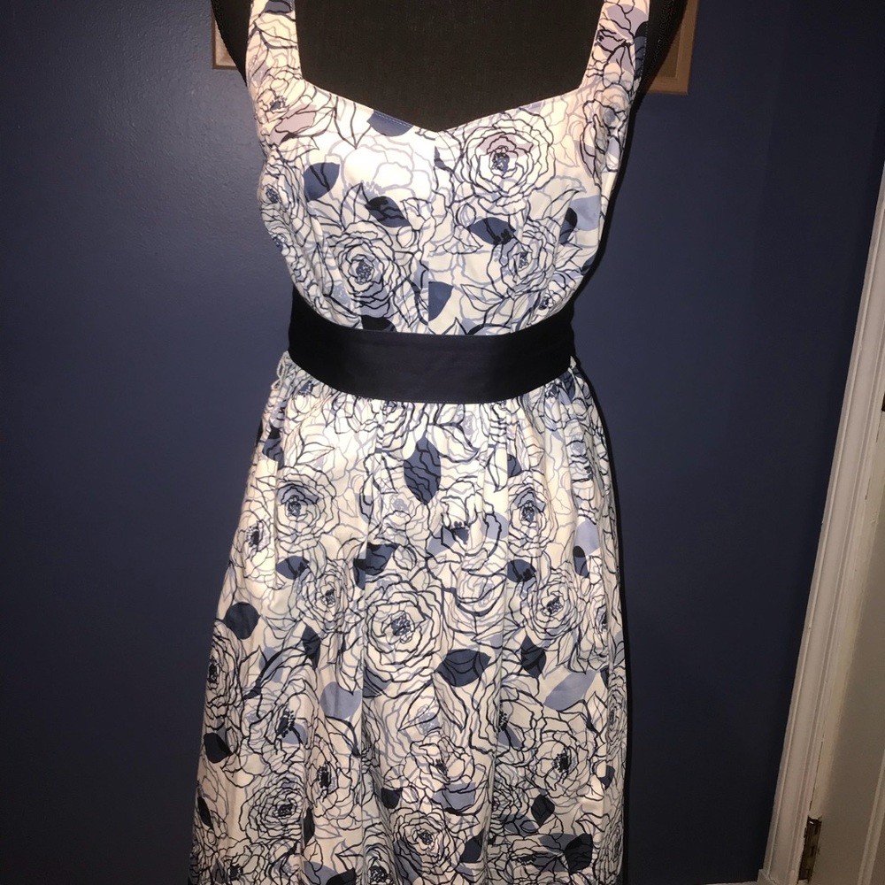 White and blue spring dress with dark blue ribbon